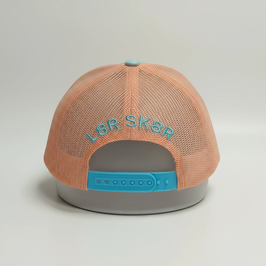 Peach-colored cap with 'L8R SK8R' text 